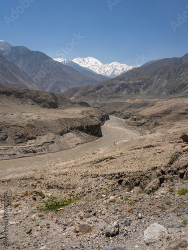 Vertical desert mountain landscape view of Indus river valley and mighty snowcapped Nanga Parbat, Thalich bridge, Astore, Gilgit Baltistan, Pakistan