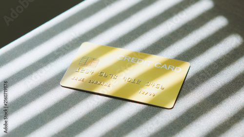Secure online payment, platinum golden credit card with Venetian blinds shadow for digital banking