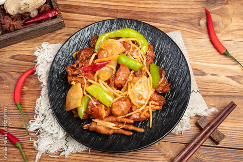 Spicy Stir Fried Chicken with Peppers and Bean Sprouts on Rustic Table