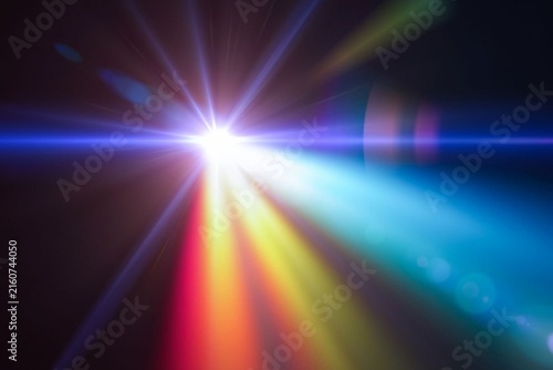Bright light bursts through dark space. Vibrant rays glow in electric colors. Blue, red, and gold streaks radiate outward. Lens flare adds depth and drama