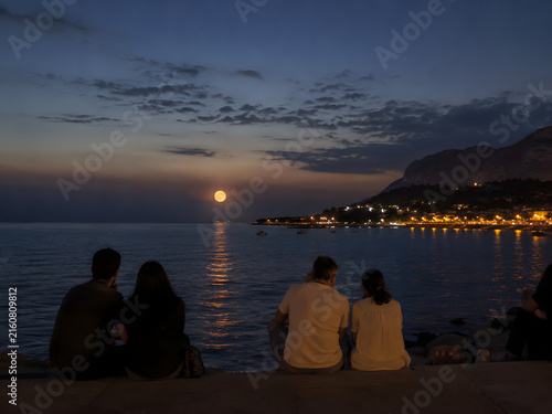 Full Moon over a Peaceful Seaside Night