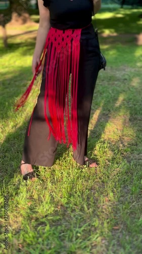 Woman wearing a stylish handmade red macrame belt