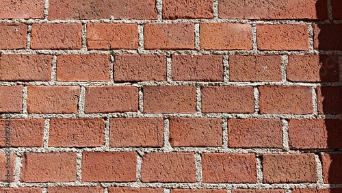Konstfotografi Red brick wall background with detailed masonry texture, rustic architectural surface, vintage building material, grunge urban backdrop