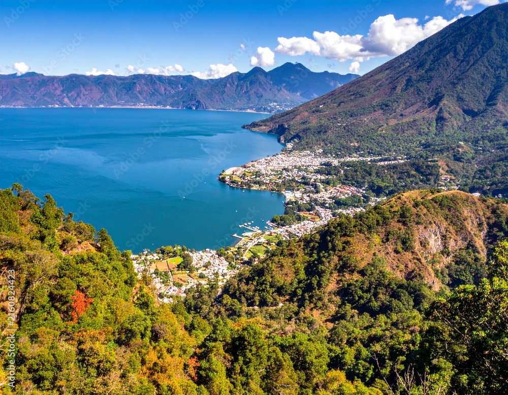 Fototapeta premium Lake Atitlan panoramic view volcanic mountains lakefront town scenic landscape guatemala asset
