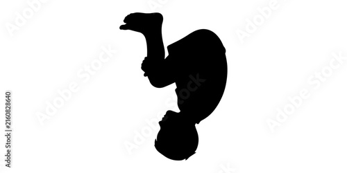 Bild auf Leinwand Silhouette of a young boy performing a somersault or jumping on a white backgrou