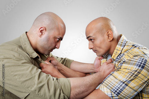Bald men fighting 