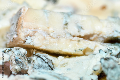 Quadro su tela Macro close-up shot of rich creamy gorgonzola blue cheese with characteristic mo