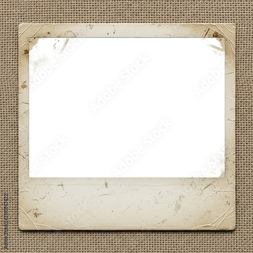 Vintage aged instant photo frame on a burlap textured background.