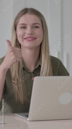 Young Blonde Woman showing Thumbs Up at Work, Vertical Video
