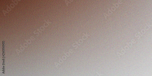 Close up of a textured brick wall with a subtle gradient of pink and gray tones