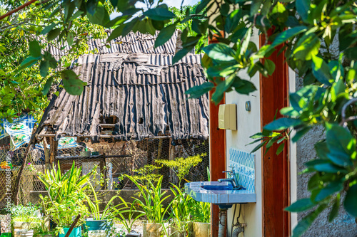 Fotografie Rustic Backyard With Old Shack and Outdoor Sink in Ek Balam, Yucatan