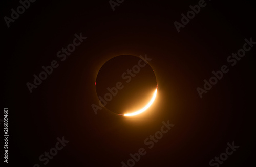 Total solar eclipse forming diamond ring effect in space