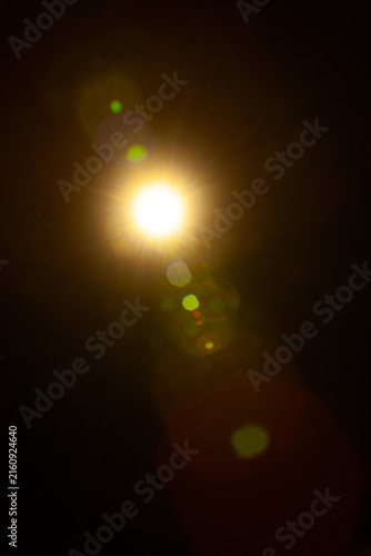 Sun flare on the black background