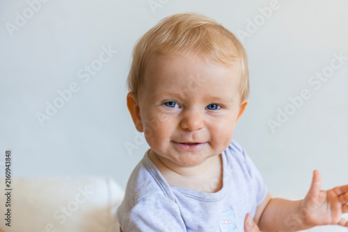 Portrait of happy blond baby girl 