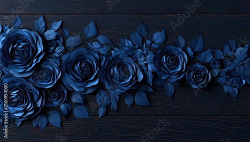 Deep blue roses cascade across a dark wooden surface, creating an elegant display