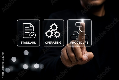 Hand pointing at holographic standard operating procedure flowchart icons