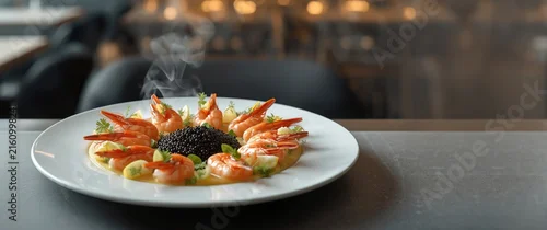 Obraz  z motywem Shrimp Dish Decorated with Caviar and Herbs on Plate in Fine Dining Setting