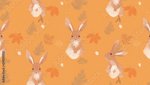 Cute Bunnies Surrounded by Autumn Leaves on an Orange Background