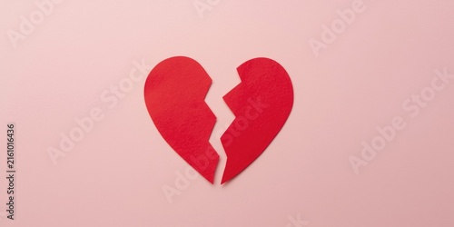 Broken Red Heart Cutout on Soft Pink Background