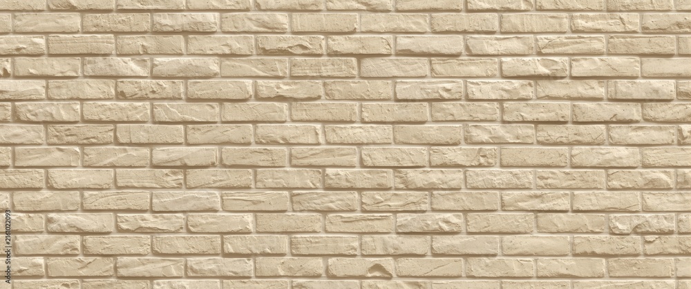 Fototapeta premium Textured Beige Brick Wall in Even Pattern