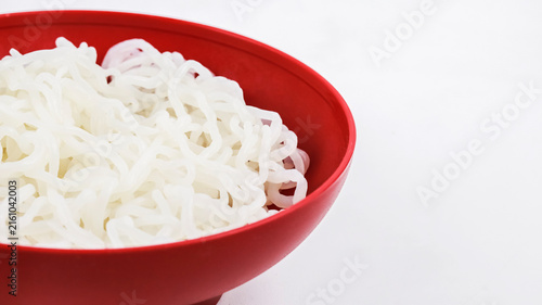 Low Angle View of Cooked Shirataki Noodles in a Red Bowl