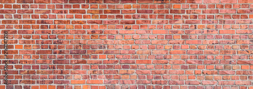 Fotografía Old red brick wall texture background surface with neat mortar lines