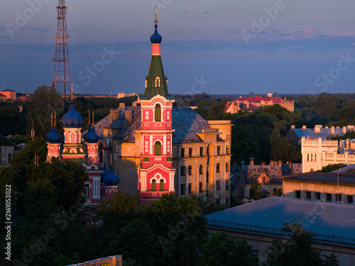 Photography Colorful historic building with onion domes and spires in the center of a city d
