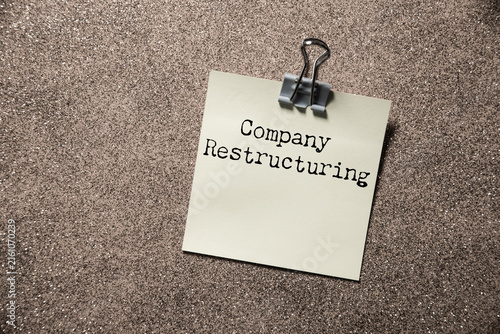 Photography There is notebook with the word company Restructuring