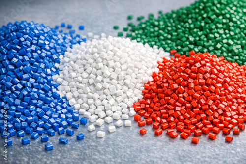 A close-up view of multiple containers filled with small, colorful plastic beads. These versatile materials can be used for various crafts and projects.