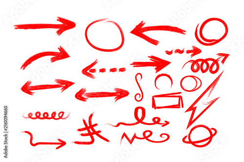 Collection of hand drawn red arrows and doodle shapes isolated on a white background for design