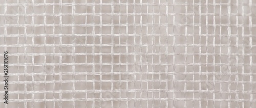 Extreme close-up orthographic cashmere wool fibers interlocking in a random dense mat with perfectly sharp texture