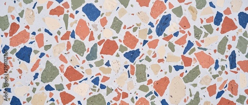 Ultra-sharp full-frame photograph of pale green glazed ceramic tile surface with handmade undulations and tiny pinholes