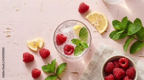 Refreshing raspberry lemonade with mint and ice top view