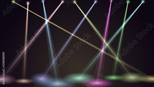 Stage spotlights casting multiple colored beams and floor circles on dark background with spotlight background illumination performance nightclub entertainment projector atmosphere abstract