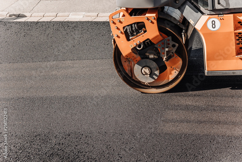 Canvastavla Road roller compactor pressing fresh asphalt during street construction