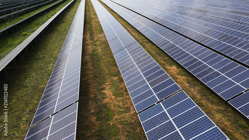 Konstfotografi Solar farm generating clean electricity with photovoltaic panels converting sunl