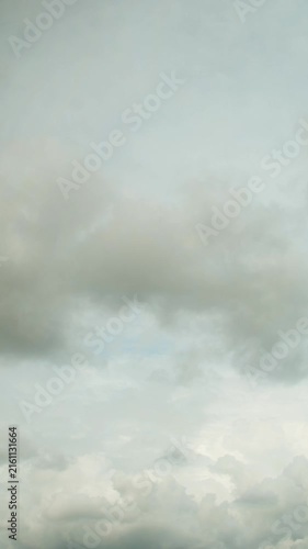 Dark clouds slowly move across the sky. A stormy sky before rain. A background with a premonition of a change in the weather.