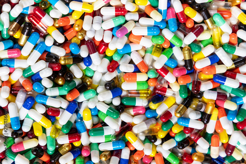 Full frame close-up background of multicolored medical Capsules, Pharmacy and Healthcare Concept.