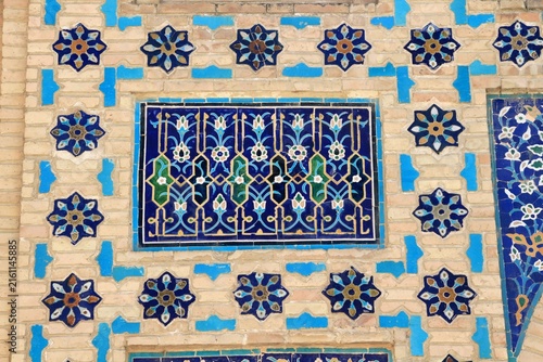 An example of Uzbek tile art featuring geometric and floral motifs. The interior and exterior walls of historical buildings in Uzbekistan are adorned with tiles.