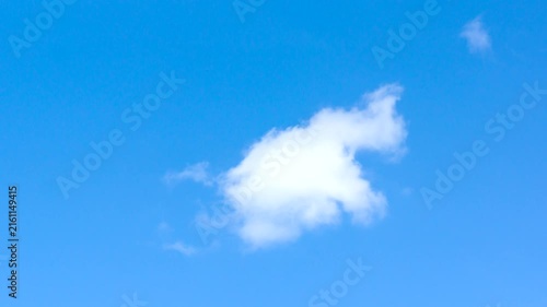 Blue sky with white light clouds in  foreground