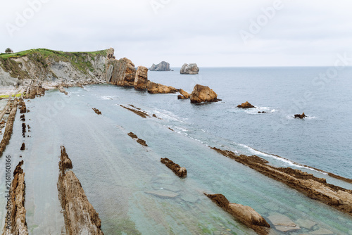 Obraz na płótnie A stunning seascape with large cliffs jutting out of the water