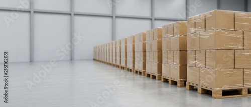 Long row of palletized cardboard boxes wrapped in stretch film in modern warehouse. Industrial logistics background with large copy space for supply chain, storage and distribution design.