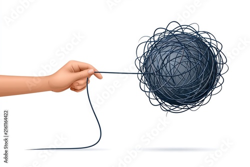 Obraz na płótnie Hand pulling thread unraveling tangled yarn ball complexity concept