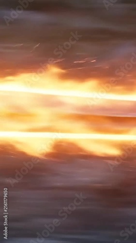 Abstract fiery motion blur background with bright glowing horizontal lines