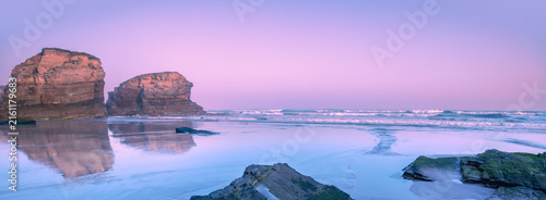 Seascape in the morning. Rocky sea coast at sunrise. Beach Playa de Las Catedrales in Ribadeo, Galicia, Spain, Europe