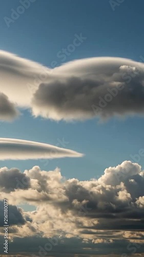 Stunning blue sky filled with beautiful puffy white clouds and dramatic atmospheric layers