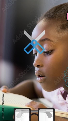 Animation of school icons scrolling over schoolgirl reading in class