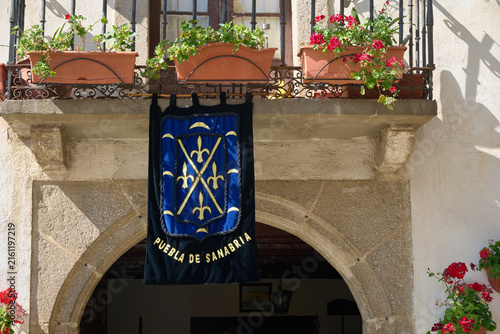 Puebla de Sanabria banner hanging from a historic building balcony