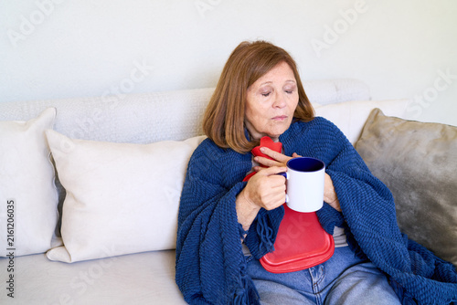Obraz na płótnie Elderly woman recovering from illness at home, self-care and wellness, senior he