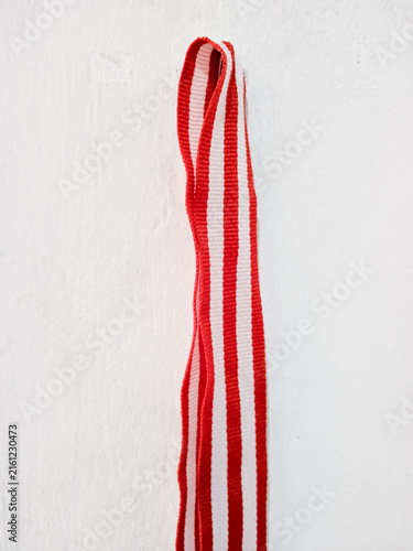 Red white striped fabric ribbon hanging on wall textile craft material